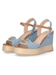 Liu Jo Sandały w kolorze błękitnym na koturnie rozmiar: 37. Niebieskie sandały Liu Jo, bez wzorów, z materiału, z otwartym noskiem, bez obcasa, na koturnie, bez zapięcia. Za 301.48 zł.