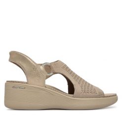 Sandały Skechers. Brązowe sandały Skechers, bez wzorów, bez obcasa, na koturnie, bez zapięcia. Za 359.99 zł.