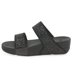 Kobiece klapki na koturnie FitFlop Lulu Slide. Czarne klapki FIT FLOP, bez wzorów, bez obcasa, na koturnie. Za 484.50 zł.