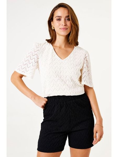 Garcia Koszulka w kolorze niebieskim rozmiar: L. Brązowe bluzki Garcia, l, bez wzorów, z koronki, bez kołnierzyka, bez ramiączek. Za 104.89 zł.