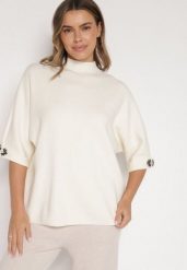 Jasnobeżowy Sweter Ozdobiony na Rękawach Cyrkoniami Aletusa. Brązowe swetry Born2be, z aplikacjami, z jeansu, bez ramiączek. Za 99.99 zł.