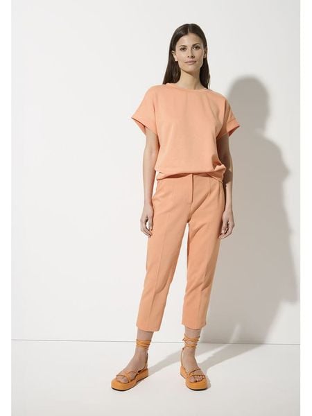 More & More Koszulka w kolorze brzoskwiniowym rozmiar: 38. Pomarańczowe bluzki More & More, bez wzorów, bez kołnierzyka, bez ramiączek. Za 139.95 zł.
