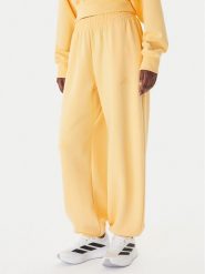 Adidas Spodnie dresowe Soft Lux KA7020 Pomarańczowy Loose Fit. Brązowe spodnie dresowe Adidas, m, bez wzorów, z dresówki. Za 328.99 zł.