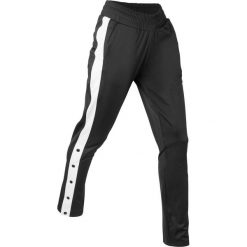 Spodnie sportowe, z rozpinanymi nogawkami, długie bonprix czarny. Spodnie dresowe marki bonprix. Za 89.99 zł.