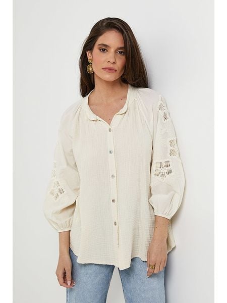 Rodier Lin Lniana bluzka w kolorze kremowym rozmiar: M/L. Brązowe bluzki Rodier Lin, l, bez wzorów, z koronki, bez kołnierzyka, bez ramiączek. Za 158.47 zł.