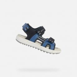 Sandały GEOX J SANDAL ALBEN Niebieski. Niebieskie sandały Geox, bez wzorów, ze skóry, sportowe, bez obcasa, bez zapięcia. Za 243.99 zł.