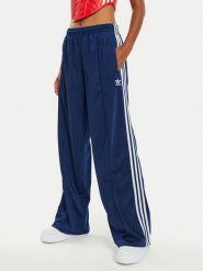 Adidas Spodnie dresowe Firebird IL3817 Granatowy Loose Fit. Niebieskie spodnie dresowe Adidas, s, bez wzorów, z dresówki. Za 329.99 zł.