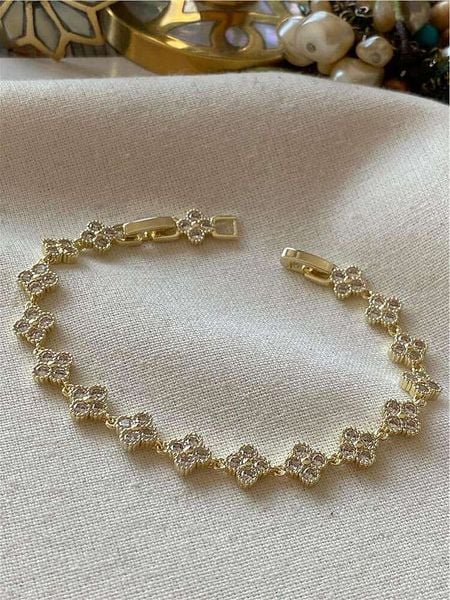 Luseera Pozłacana bransoletka z elementami ozdobnymi rozmiar: onesize. Żółte bransoletki Luseera, z cyrkonią, pozłacane. Za 65.99 zł.