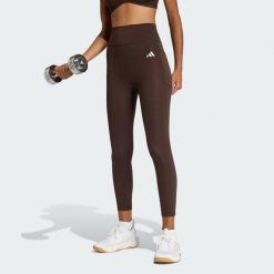 Legginsy 7/8 bez szwu z przodu Optime Essentials. Brązowe legginsy Adidas, bez wzorów. Za 219.00 zł.