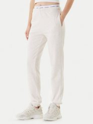 Guess Spodnie dresowe O5RB01 KCO31 Beżowy Regular Fit. Brązowe spodnie dresowe Guess, xl, z aplikacjami, z bawełny. Za 269.99 zł.