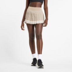Spódnica damska New Balance WK51402ADS – beżowa. Brązowe spódnice New Balance, m, bez wzorów, z materiału. Za 229.99 zł.