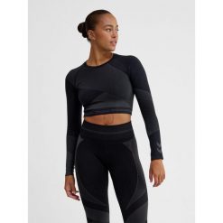 Damska bluzka treningowa bezszwowa z długim rękawem Hummel. Niebieskie bluzki Hummel, bez wzorów, z materiału, sportowe, bez kołnierzyka, bez ramiączek. Za 181.50 zł.