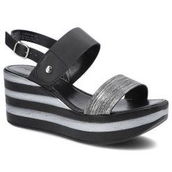 Czarne Sandały Tamaris Damskie Buty Na Koturnie. Czarne sandały Tamaris, bez wzorów, ze skóry ekologicznej, bez obcasa, na koturnie, bez zapięcia. Za 199.00 zł.