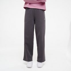 Spodnie dresowe damskie Puma Gym & Pilates. Czarne spodnie dresowe Puma, l, bez wzorów, z bawełny, na fitness i siłownię. Za 129.99 zł.