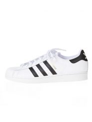 Adidas Skórzane sneakersy "Superstar" w kolorze biało-czarnym rozmiar: 46 2/3. Białe trampki Adidas, bez wzorów, bez zapięcia. Za 222.41 zł.