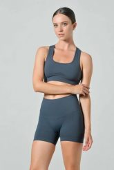 Damskie krótkie legginsy push-up z wysokim stanem Omm Yoga by Risalti Sculpt. Niebieskie legginsy OM, l, bez wzorów, z elastanu, z podwyższonym stanem, krótkie. Za 199.99 zł.