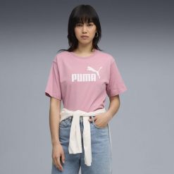Damska luźna koszulka Essentials z logo No.1 PUMA Poised Pink. Czerwone bluzki Puma, bez wzorów, z gumy, sportowe, bez kołnierzyka, bez ramiączek. Za 99.00 zł.