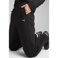 Damskie spodnie dresowe EVOSTRIPE PUMA Black. Czarne spodnie dresowe Puma, l, bez wzorów, z dresówki, trekkingowe. W wyprzedaży za 129.00 zł.