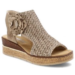 Beżowe Sandały Rieker Eleganckie Obuwie Damskie Na Koturnie. Brązowe sandały Rieker, bez wzorów, z materiału, eleganckie, bez obcasa, na koturnie, bez zapięcia. Za 359.00 zł.