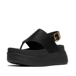 Kobiece sandały na koturnie ze skórzaną tylną paskiem FitFlop F-Mode. Czarne sandały FIT FLOP, bez wzorów, z materiału, eleganckie, bez obcasa, na koturnie, bez zapięcia. Za 617.00 zł.