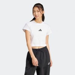 Koszulka damska ADIDAS. Bluzki Adidas, m, bez wzorów, z bawełny, bez kołnierzyka, bez ramiączek. Za 99.99 zł.