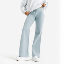 Rozszerzane legginsy damskie Elementals. Niebieskie legginsy DECATHLON, m, bez wzorów, z bawełny. Za 89.99 zł.