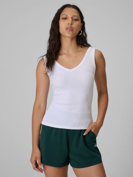 4F Top slim z prążkowanej dzianiny damski - biały S. Białe topy 4f, s, bez wzorów, z bawełny, bez kołnierzyka, bez ramiączek. Za 49.99 zł.