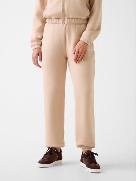 Guess Spodnie materiałowe 169841 Beżowy Slim Fit. Brązowe spodnie dresowe Guess, l, z aplikacjami, z dresówki. Za 349.99 zł.