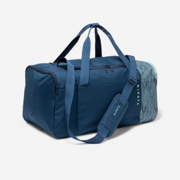 Torba sportowa Kipsta Essential 55 l. Niebieskie torby na ramię KIPSTA, bez wzorów, z materiału, sportowe, na ramię, średnie, bez dodatków. Za 59.99 zł.
