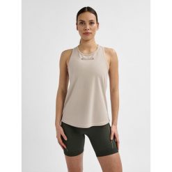 Damski tank top Hummel TE Tola. Czerwone topy Hummel, xl, bez wzorów, bez kołnierzyka, bez ramiączek. Za 107.50 zł.