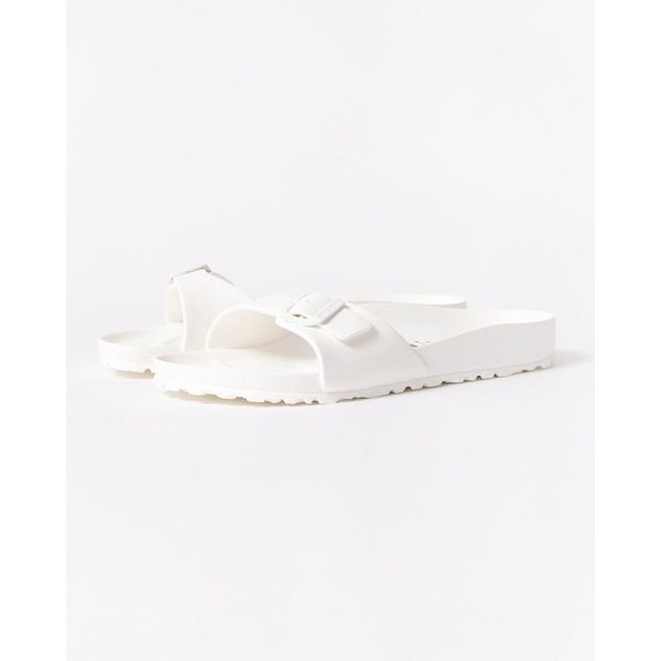 Klapki damskie Birkenstock Eva Madrid. Białe klapki Birkenstock, bez wzorów, z materiału, bez obcasa. Za 169.00 zł.