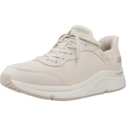 Kapcie SKECHERS BOBS ARCH COMFORT B Beżowy. Brązowe obuwie domowe Skechers, bez wzorów, z syntetyku, bez zapięcia. Za 312.99 zł.