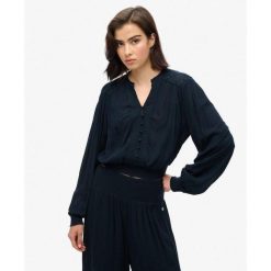 Bluzka z długim rękawem z marszczoną koronką. Niebieskie bielizna sportowa Superdry, l, bez wzorów, z koronki. Za 284.00 zł.