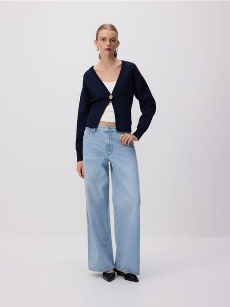 Jeansy wide leg ze średnim stanem - niebieski. Niebieskie jeansy Reserved, bez wzorów. Za 179.99 zł.