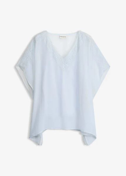 Tunika z koronkową wstawką. Niebieskie tuniki bonprix, bez wzorów, z koronki, bez kołnierzyka, bez ramiączek. Za 54.99 zł.