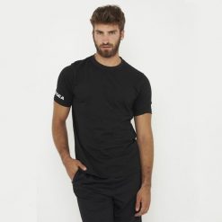 Koszulka bawełniana ARIA czarna. Czarne bluzki LEGEA, bez wzorów, z bawełny, sportowe, bez kołnierzyka, bez ramiączek. Za 52.00 zł.