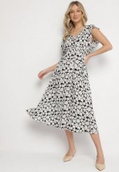 Czarna Bawełniana Sukienka w Kwiatki o Rozkloszowanym Kroju z Gumką Alanilia. Czarne sukienki Born2be, na co dzień, na lato, l, bez wzorów, z bawełny, eleganckie, bez kołnierzyka, bez ramiączek, maxi, kopertowe. Za 49.99 zł.