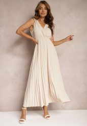 Beżowa Rozkloszowana Sukienka Plisowana z Wiskozą i Bawełną Wykończona Gumką w Talii Yefia. Brązowe sukienki Renee, l, bez wzorów, z bawełny, bez kołnierzyka, bez ramiączek, maxi, dopasowane. Za 69.99 zł.