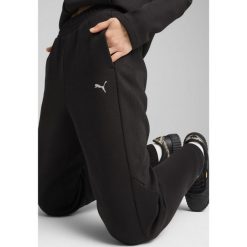 Damskie spodnie dresowe EVOSTRIPE PUMA Black. Czarne spodnie dresowe Puma, s, bez wzorów, z dresówki, trekkingowe. Za 212.99 zł.