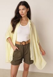 Żółta Zwiewna Koszula Letnia Oversize z Bawełny o Nietoperzowym Kroju Canomela. Żółte koszule Born2be, l, bez wzorów, z bawełny, eleganckie, bez kołnierzyka, bez ramiączek. Za 139.99 zł.