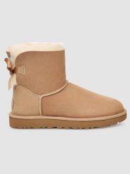 UGG Skórzane botki "Mini Bailey Bow II" w kolorze beżowym rozmiar: 36. Brązowe botki UGG, bez wzorów, ze skóry, bez obcasa, bez zapięcia. Za 594.39 zł.