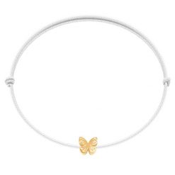 Bransoletka z pozłacanym motylem Etincelle na cienkim białym sznurku. Białe bransoletki Lilou, pozłacane. Za 79.00 zł.