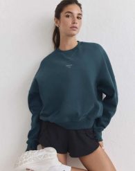 Damska bluza biegowa oddychająca, odprowadzająca wilgoć Le Run lagunowa. Zielone bluzy AIM'N, s, bez wzorów, z bawełny, bez kaptura. Za 387.00 zł.