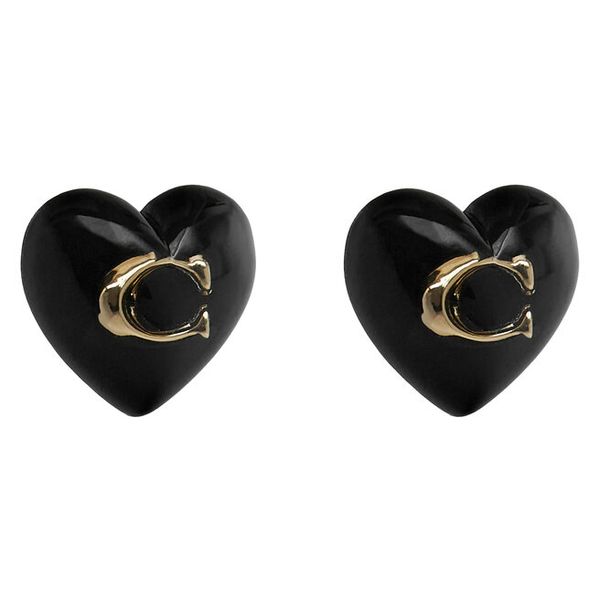 Kolczyki Coach. Żółte kolczyki Coach, złote. Za 229.99 zł.