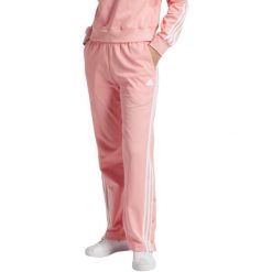 Spodnie damskie adidas Iconic Wrapping 3-Stripes Snap. Czerwone spodnie materiałowe Adidas, na co dzień, bez wzorów, z bawełny. Za 229.99 zł.