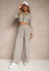 Jasnoszare Spodnie o Szerokim Kroju z Bawełną High Waist Ozdobione Naszywką Naneriela. Szare spodnie materiałowe Renee, na co dzień, l, z aplikacjami, z bawełny, z podwyższonym stanem. Za 49.99 zł.