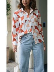 Milan Kiss Bluzka w kolorze biało-pomarańczowym rozmiar: S. Białe bluzki Milan Kiss, s, bez wzorów, z wiskozy, bez kołnierzyka, bez ramiączek. Za 109.26 zł.