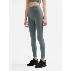 Legginsy sportowe dla kobiet Hummel. Szare legginsy Hummel, bez wzorów, z materiału, na fitness i siłownię. Za 130.50 zł.