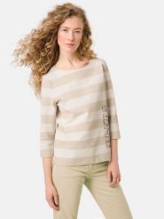 Gerry Weber Koszulka w kolorze beżowo-kremowym rozmiar: 42. Brązowe bluzki Gerry Weber, bez wzorów, bez kołnierzyka, bez ramiączek. Za 154.07 zł.