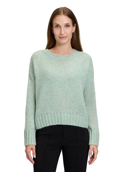 CARTOON Sweter w kolorze zielonym rozmiar: 42. Zielone swetry Cartoon, bez wzorów, z wełny, bez ramiączek. Za 105.14 zł.